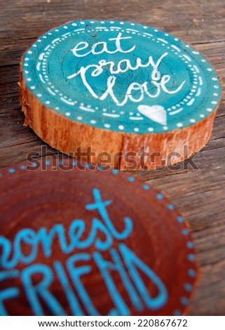 closeup of Badges with words, honest friend, eat pray love