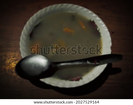 Defocused abstract baground of traditional food of Indonesia, call named 'kolak' or hot fruit soup with coconut milk and brown sugar Stok fotoğraf © 