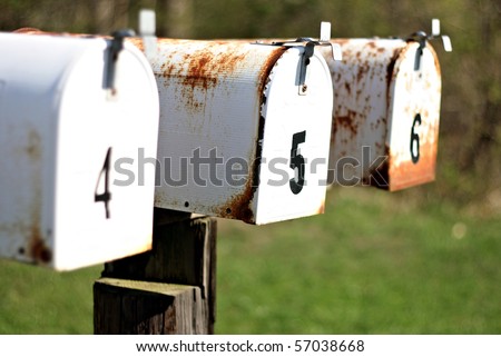 A set of mailboxes with the numbers four, five, and six on them