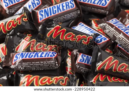 Tambov, Russian Federation - September 01, 2012: Snickers and Mars minis candy bars heap. Full Frame. Studio shot. Snickers and Mars bars manufactured by Mars, Incorporated.
