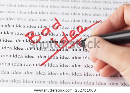 Woman\'s hand with red pen writing words \