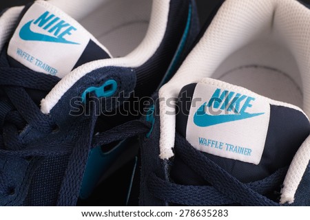Tambov, Russian Federation - May 10, 2015 New blue Nike waffle trainer shoes. Close-up. Studio shot.