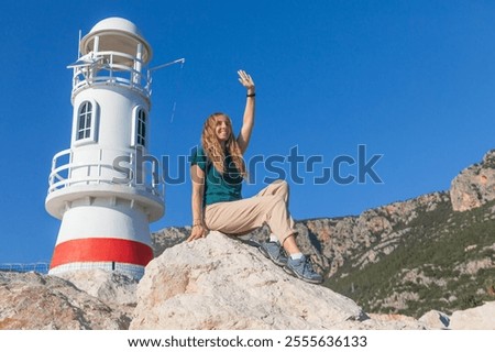 Similar – Image, Stock Photo Woman sitting near waving sea