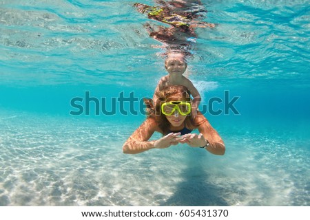 Similar – Image, Stock Photo Mother and son diving on a swimming pool