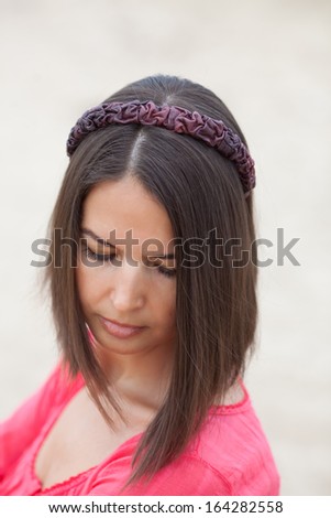 Beautiful girl wearing a handmade hair band on the sea