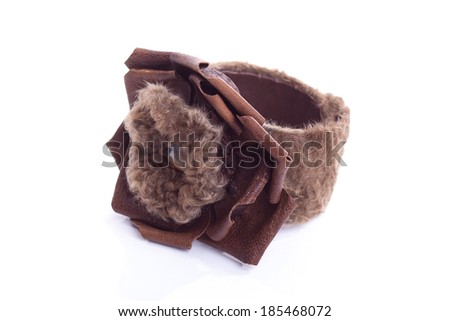 Designer handmade brown bracelet with leather and fur isolated on white