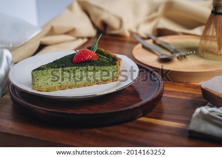 Similar – Image, Stock Photo Matcha cheesecake slice tart. Green cake slices equally