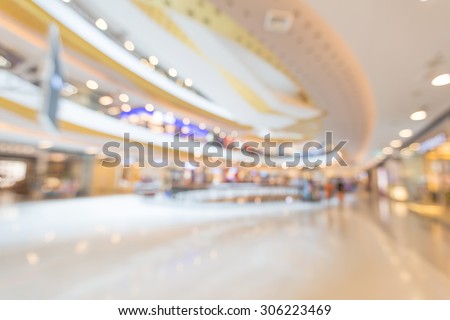 Blurred beautiful structure of interior shopping mall with bokeh for business promotion background