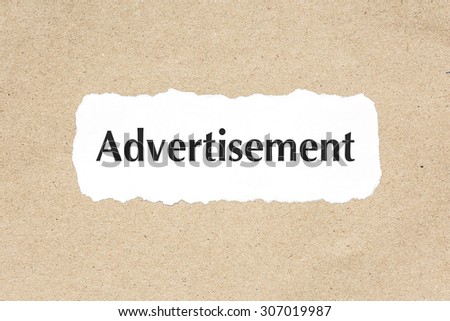 Advertisement word on white ripped paper on brown document texture