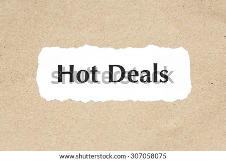 Hot Deals word on white ripped paper on brown document texture