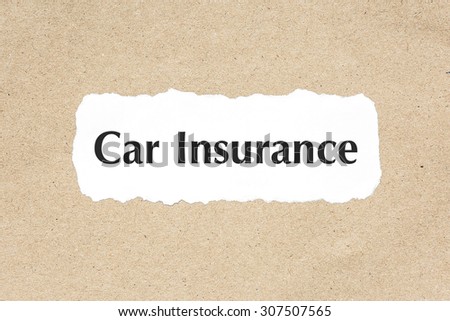 Car Insurance word on white ripped paper on brown document texture