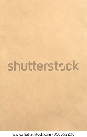 Old vintage blurry brown cardboard paper texture for blurry background