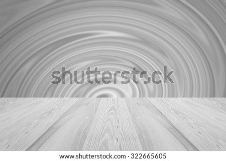 Wood table top with grey blurry twirl abstract background for display or montage your product