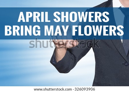 Business man touching April Showers Bring May Flowers word on blue virtual screen