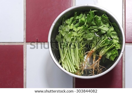 Vegetables in a bowl made from stainless steel in the water.