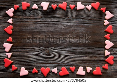frame heart color cookies on wooden background