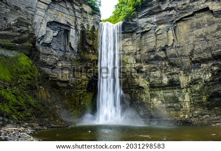 Mountain waterfall in the forest. Waterfall view. Waterfall in mountains. Waterfall pool