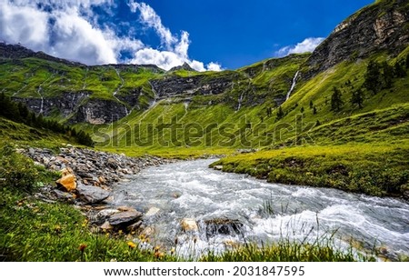 Mountain river in the valley. River valley in mountains. Mountain river valley landscape. Mountain river view