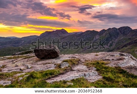 Sunset with clouds in the mountains. Mountain sunset sky. Sunset in mountains. Mountain sunset landscape