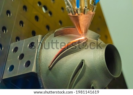 Direct metal deposition - advanced additive laser melting and powder spray manufacturing technology for repair, rebuild metal workpieces - close up. Metalworking, robotic, industrial concept 商業照片 © 