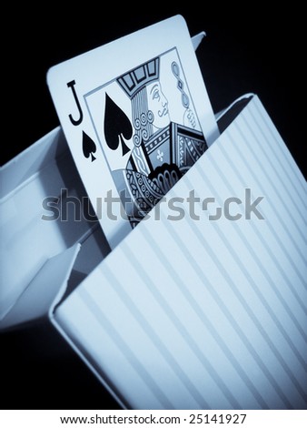 Jack of spades in a box, a conceptual photograph of jack in the box in selenium tone