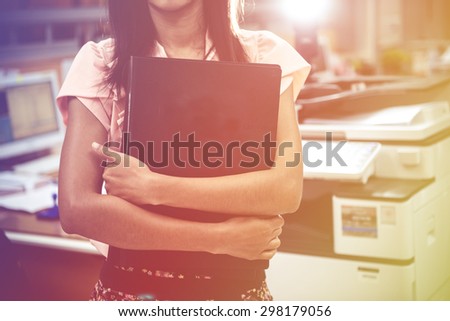 business woman holding document file in office