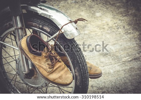 Men's leather shoes and old Motorcycles.,Vintage concept