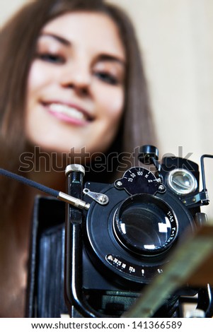 Young girl with big old camera rarity