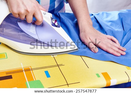 Woman ironed men\'s shirt close-up