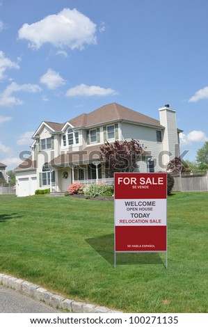 For Sale Sign on Suburban Home Front Yard Lawn