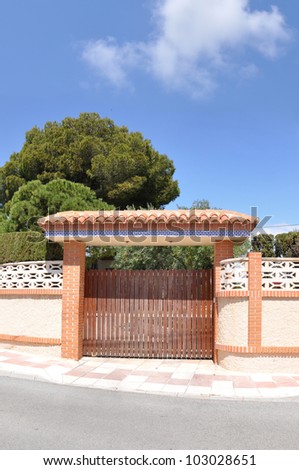 Mediterranean Gate Entrance to Driveway in Spain Europe Blue Sky Sunny Day