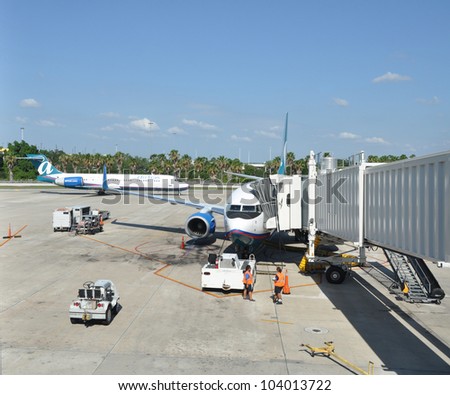 ORLANDO, FLORIDA - MAY 27: Air Tran airline based in Orlando (purchased by Southwest Airlines on May, 2, 2011) preparing planes for take off from airport in Orlando May 27, 2012.