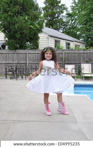 Beautiful Smiling Blue Eye Curly Hair Five Year Old Girl Posing Dress and Boot high Sneakers