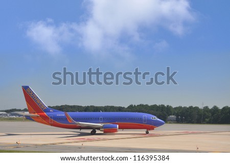 BALTIMORE, MARYLAND - JUN 8: Southwest Airline Boeing 737-3H4 (1st  flight March 6, 1992) preparing to depart from BWI (Baltimore Airport) a hub station for Southwest Airline. Baltimore June 8, 2012