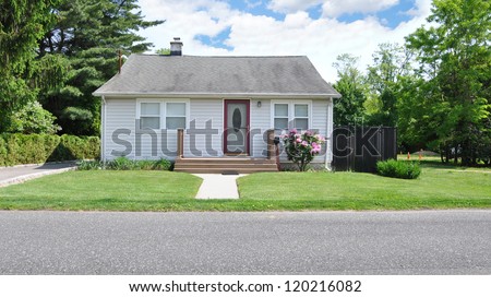 Small Suburban Bungalow Cottage Home Blooming Rhododendron Flowers Sunny Day