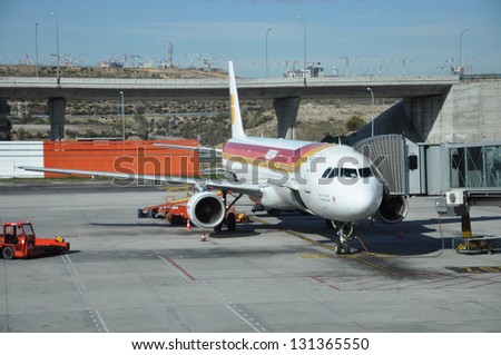 MADRID, SPAIN - MAR 1: Iberia Airline Airbus A321 (in fleet since 1999) is preparing for takeoff. Iberia merged with British Airways in 2010. It's the 3rd highest revenue airline. Madrid, Mar 1, 2013.