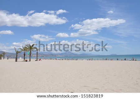 SAN JUAN, ALICANTE, SPAIN - MAY 19: Playa de San Juan is 7 kilometers long and is Alicante\'s longest beach. Beach goers can see Puig Campana and Benidorm from this beach. San Juan, May 19, 2013.