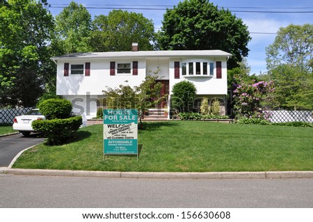 Real Estate Sale Pending Under Contract For Sale Sign Suburban Home High Ranch Style Sunny Residential Neighborhood Blue Sky Day USA