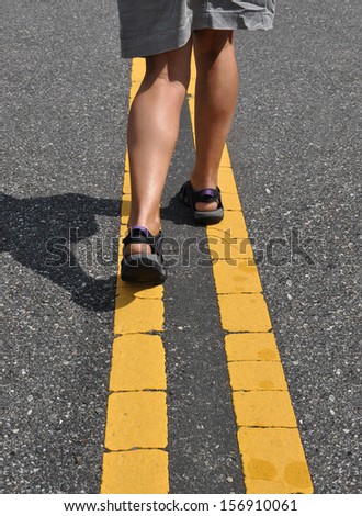 Yellow Traffic Line Woman Wearing Sandals Walking on Dividing Line Street