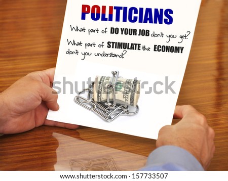 US Currency Chained with message Politicians What part of stimulate the economy don\'t you get?