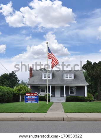 American Flag Pole Real Estate For Sale Welcome Open House Sign on front yard lawn of Suburban House in Residential Neighborhood Blue Sky Clouds USA