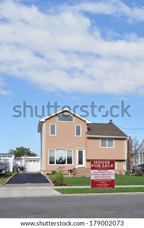 Suburban Tan Home Landscaped Lawn Residential Neighborhood Blue Sky Clouds USA
