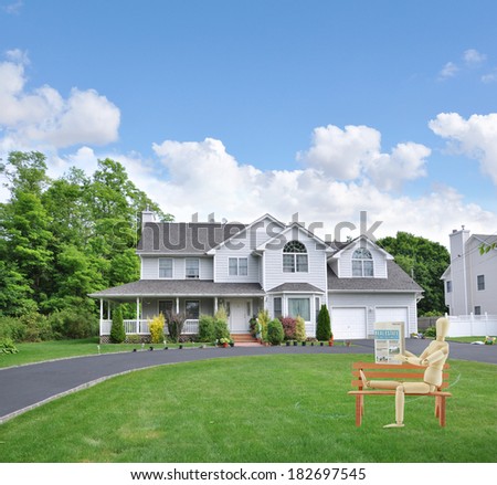 Mannequin Sitting Read Real Estate Buy / Sell Section of Newspaper on wood bench front yard lawn suburban mcmansion style home residential neighborhood usa blue sky clouds
