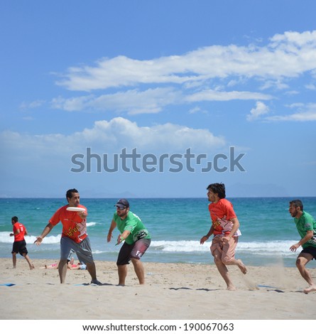 ALICANTE, SPAIN - APR 27: Seville\'s Frisbillanes Frisbee team member blocking pass in first Ultimate Frisbee  Tournament Apr 26-27 held on San Juan Beach in Alicante. April 27, 2014.