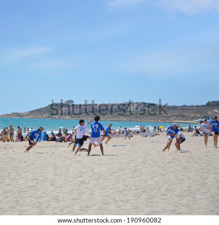 ALICANTE, SPAIN - APR 27: Alicante\'s frisbee team Barbaras wearing blue are competing in the First Ultimate Frisbee Tournament held at San Juan Beach in Alicante, April 27, 2014.