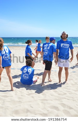 ALICANTE, SPAIN - APR 27: Alicante\'s Barbaras frisbee team coming off field switching players during 1st Ultimate Frisbee Tournament hosted in Spain on the beach of San Juan in Alicante Apr 27, 2014.