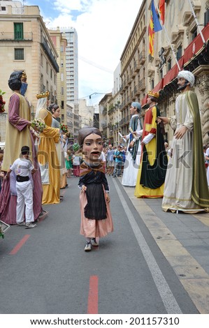 ALICANTE, SPAIN - JUN 22: Bighead in front of town hall for the start of  the annual Hogueras St John the Baptist Summer Solstice Parade of Giants and Big Heads  in Alicante, Jun 22, 2014.