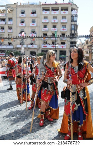 ALCOY, SPAIN - MAY 14: Female Christian legion marching in largest annual Moors and Christians parade commerating battles during the 8-15th century between Muslims and Christians. Alcoy May 14, 2011