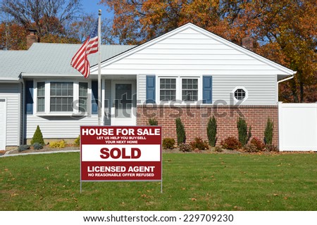 American Flag Pole Sold Real Estate (let us help you buy /sell your next home) suburban home residential neighborhood USA fall season blue sky