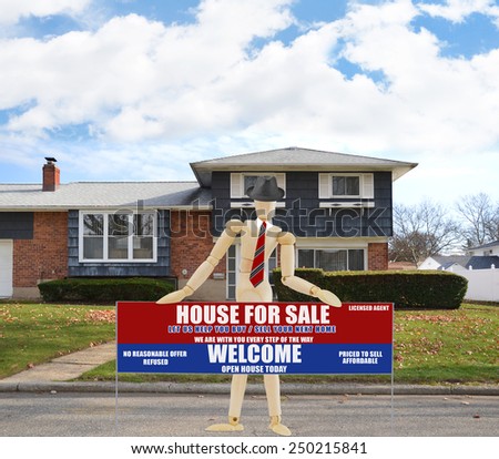 Mannequin wearing red tie holding Real estate for sale open house welcome sign Suburban high ranch brick home autumn blue sky clouds day residential neighborhood USA